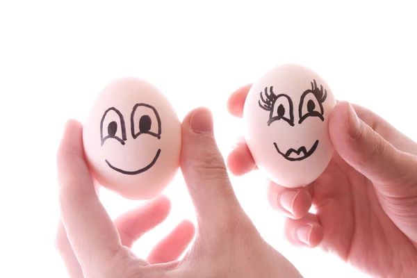 Beyaz izole elinde iki yumurta — Stok fotoğraf