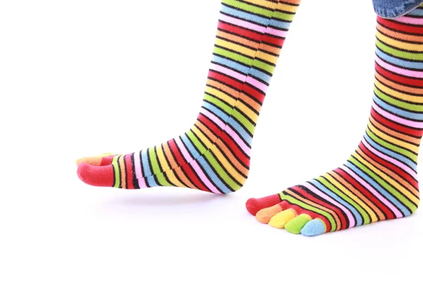 Woman legs in strip sock on white background — Stock Photo, Image