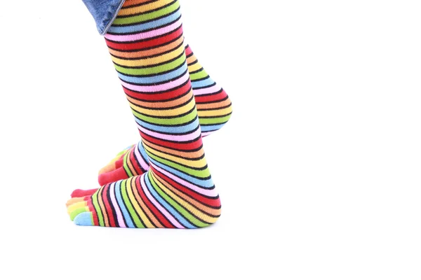 Patas de mujer en calcetín de tira sobre fondo blanco — Foto de Stock