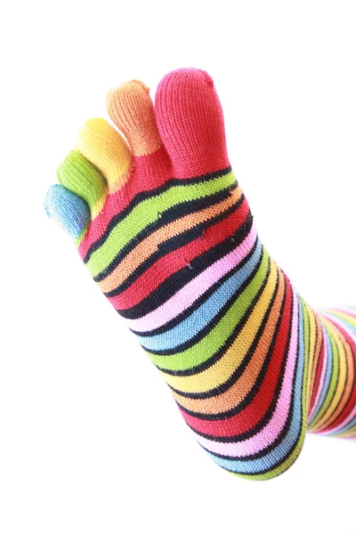 Woman legs in strip sock on white background — Stock Photo, Image