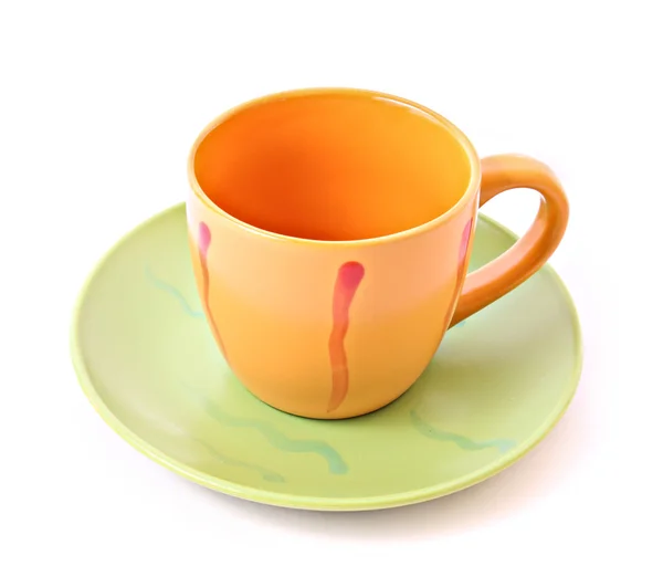 Orange cup with saucer isolated on white — Stock Photo, Image