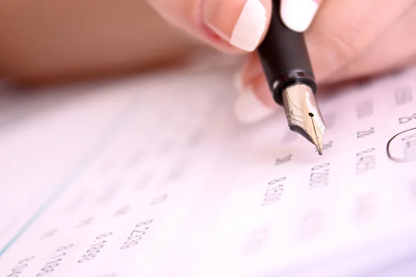 Pen in hand make some corrections in printed digits — Stock Photo, Image