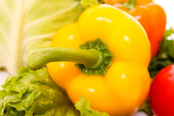 Orange pepper on vegetables background — Stock Photo, Image