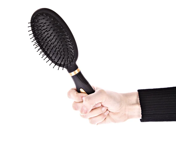 Hairbrush in hand isolated on white — Stock Photo, Image