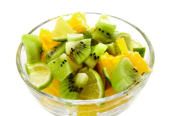 Cup with orange, kiwi and lime isolated on white — Stock Photo, Image