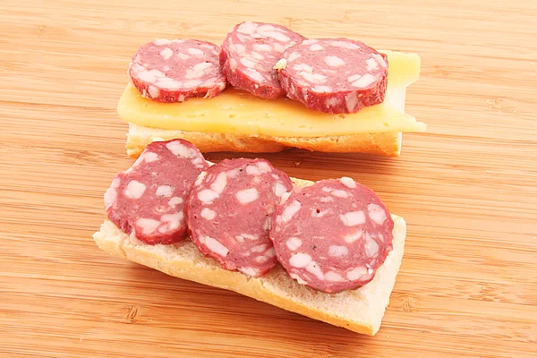 Sandwiches with sausage, cheese and bread — Stock Photo, Image