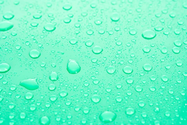 Gotas de agua fondo con grandes y pequeñas gotas —  Fotos de Stock