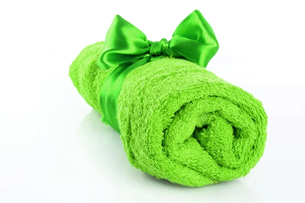 stock image Twisted green towel with band isolated on white