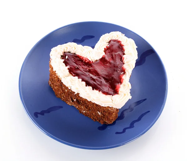 stock image Sweet cake in heart shape on blue plate