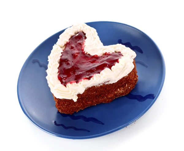 stock image Sweet cake in heart shape on blue plate