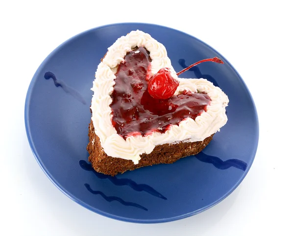 stock image Sweet cake in heart shape on blue plate