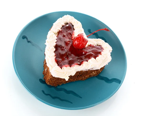 stock image Sweet cake in heart shape on green plate