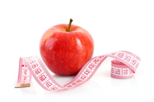 Fresh red tasty apple with measuring tape isolated on white — Stock Photo, Image