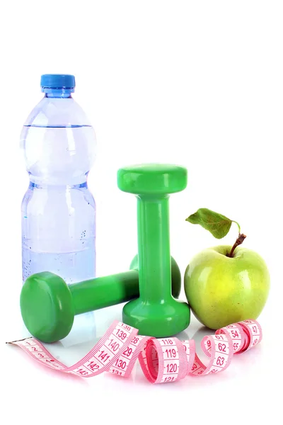 Hantle, zielone jabłko, pomiar taśmy i butelkę wody iso — Zdjęcie stockowe