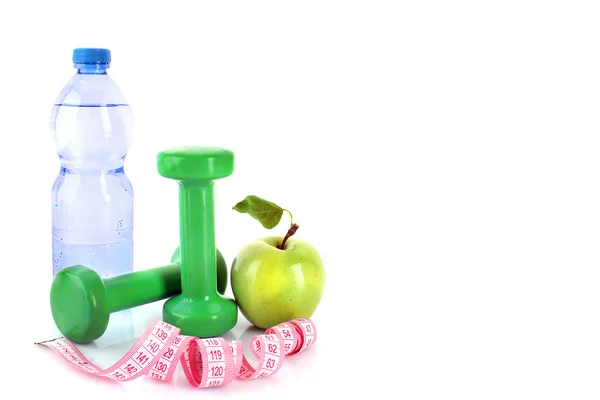 Dumbbells, green apple, measuring tape and a bottle of water iso — Stock Photo, Image