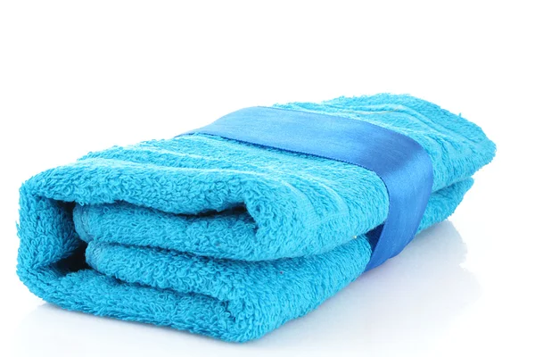 Folded blue towel with the band isolated on white — Stock Photo, Image