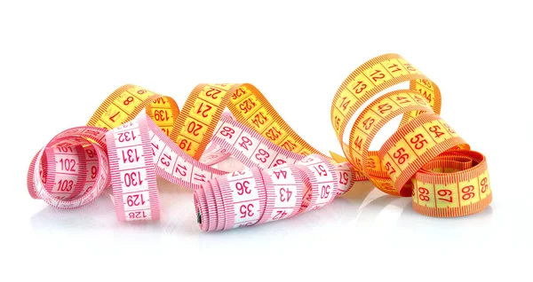 Multicoloured measuring tapes isolated on white — Stock Photo, Image