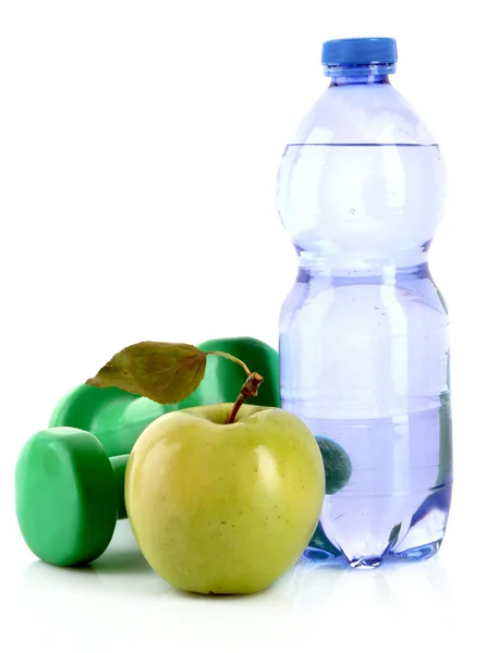 Dumbbells, green apple and water isolated on white — Stock Photo, Image