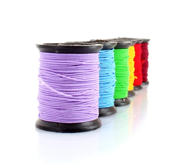 Coloured bobbins of thread isolated on white — Stock Photo, Image