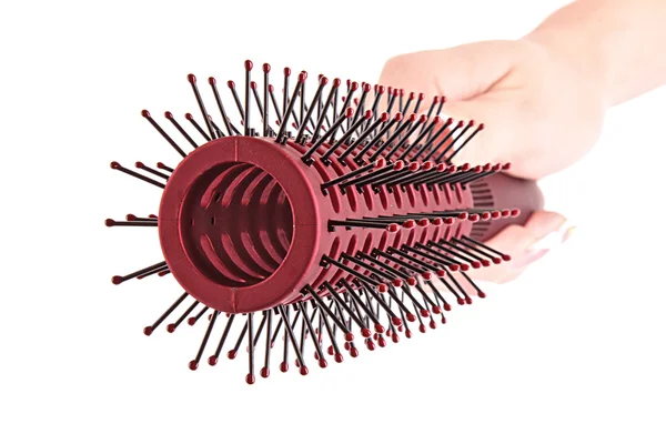 Hairbrush in hand isolated on white — Stock Photo, Image