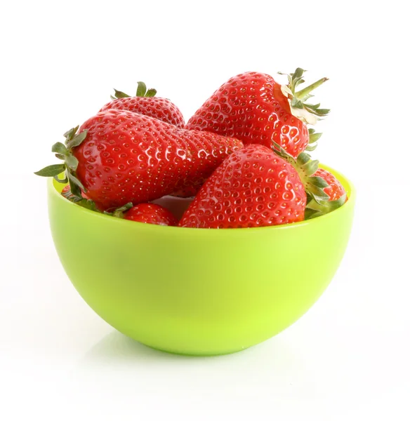 Few strawberries in green cup isolated on white — Stock Photo, Image