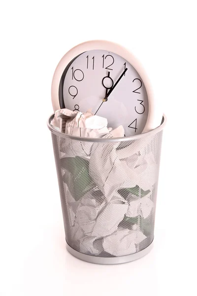 stock image Clock in trash, lost time concept