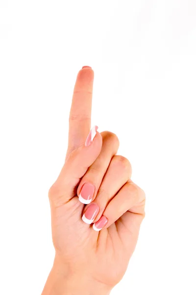 Frauenhand mit erhobenem Finger isoliert — Stockfoto