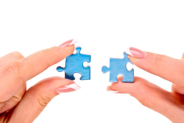 Ruce s puzzle izolovaných na bílém — Stock fotografie