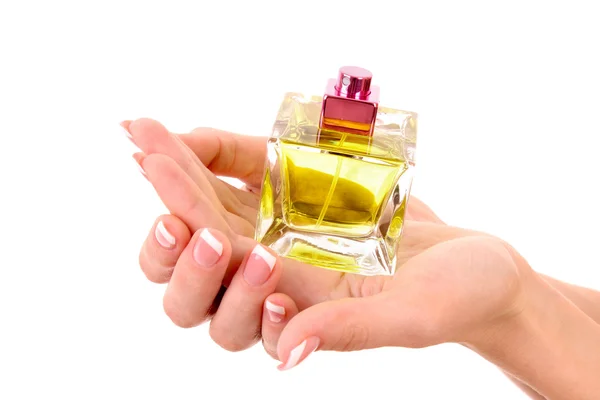 Fles parfum in de hand geïsoleerd op wit — Stockfoto