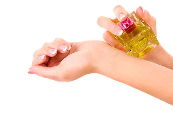 Garrafa de perfume na mão isolado em branco — Fotografia de Stock