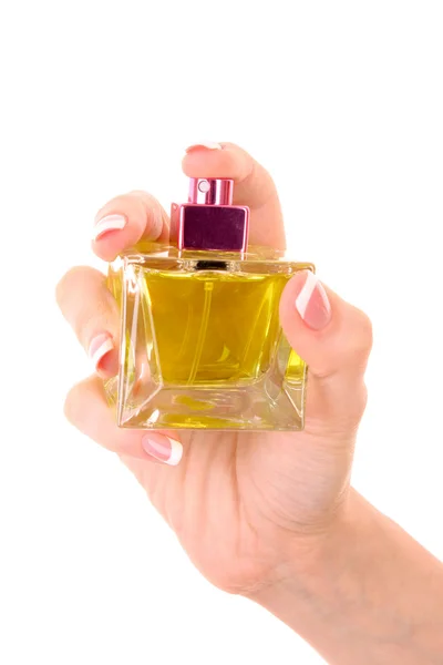 Bottiglia di profumo nella mano isolata su bianco — Foto Stock