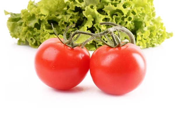 Two tomatos and salad isolated on white — Stock Photo, Image
