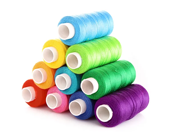 Pyramid of many-coloured bobbins of thread isolated on white — Stock Photo, Image