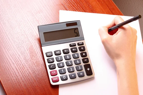 Fingers and calculator — Stock Photo, Image