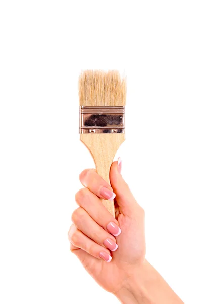Mão com escova isolada em branco — Fotografia de Stock