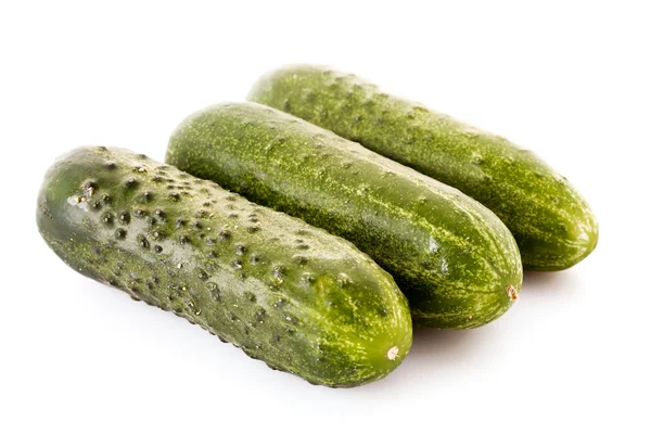 Drie komkommers geïsoleerd op wit — Stockfoto