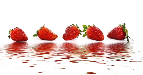 Few Strawberries with water reflection isolated on white — Stock Photo, Image