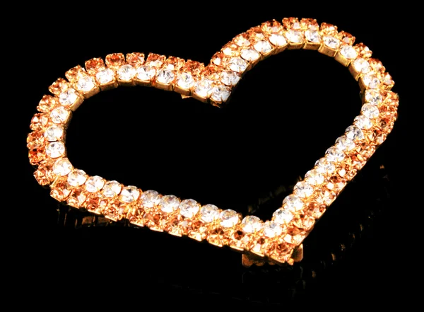 Precious heart-shaped pendant on black background — Stock fotografie