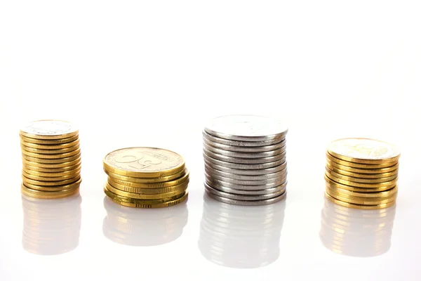 Many coins in column isolated on white — Stock Photo, Image