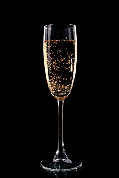 Glass with champagne on black background — Stock Photo, Image
