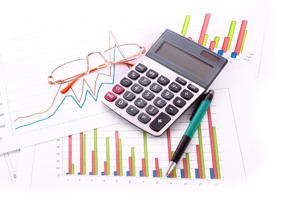 Munten, pen, rekenmachine en grafieken — Stockfoto