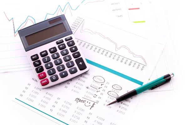 Calculadora e alguns gráficos financeiros — Fotografia de Stock