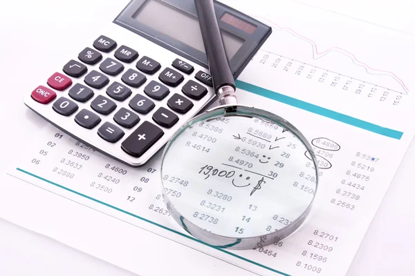 Calculator and some financial charts — Stock Photo, Image