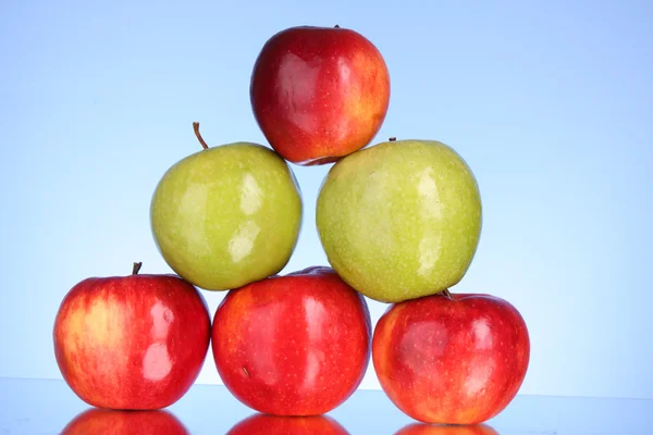 Apples on blue background — Stock Photo, Image