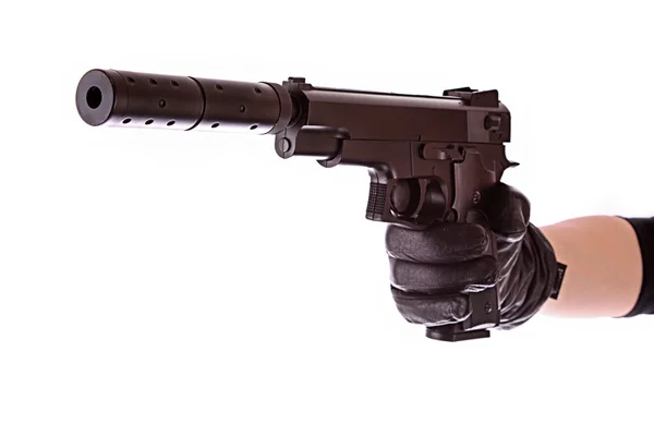 Pistol på svart handske isolerad på vit — Stockfoto