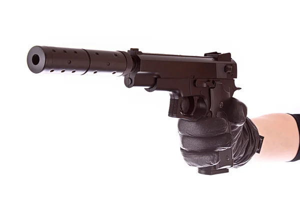 Siyah eldiven üzerinde beyaz izole tabanca — Stok fotoğraf
