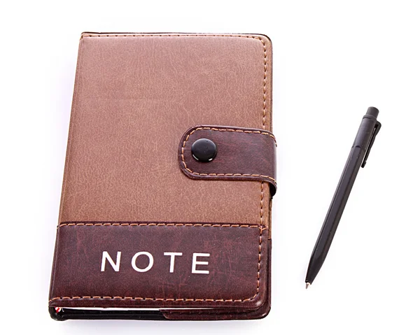 Caderno e caneta isolados sobre branco — Fotografia de Stock