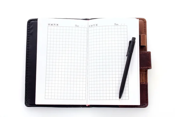 Notizbuch und Stift isoliert auf weiß — Stockfoto