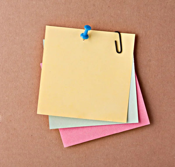 Three reminder notes with pin on cardboard — Stock Photo, Image