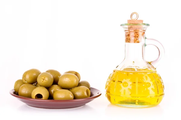 Olives and a bottle of oil isolated on white — Stock Photo, Image